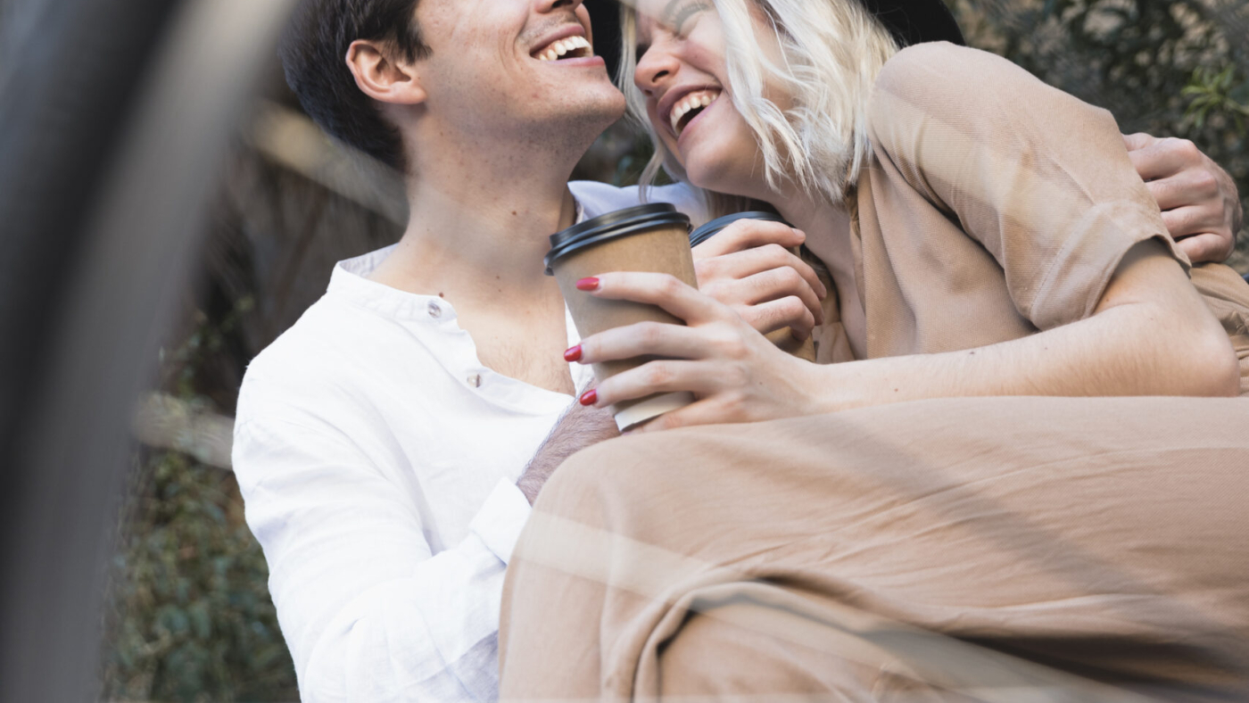 low-angle-happy-couple-bench