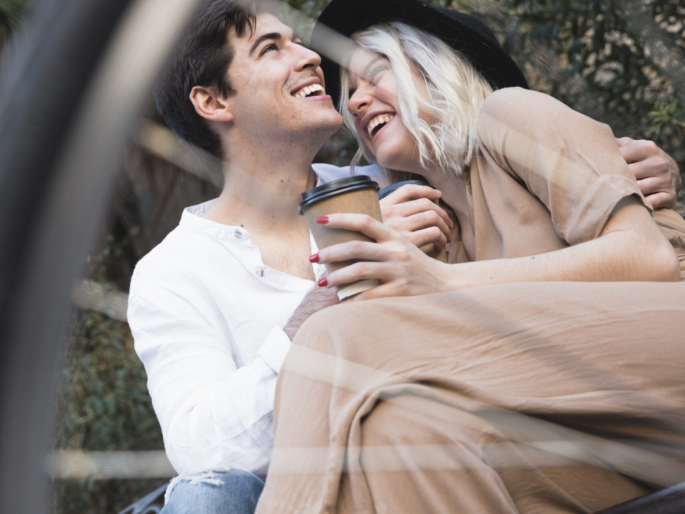 low-angle-happy-couple-bench
