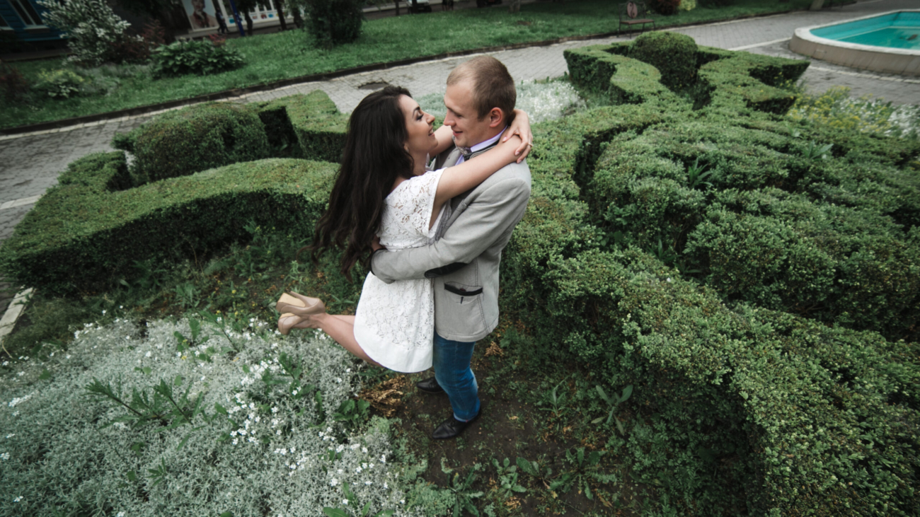 Young and beautiful European couple having a great time on the background of the city