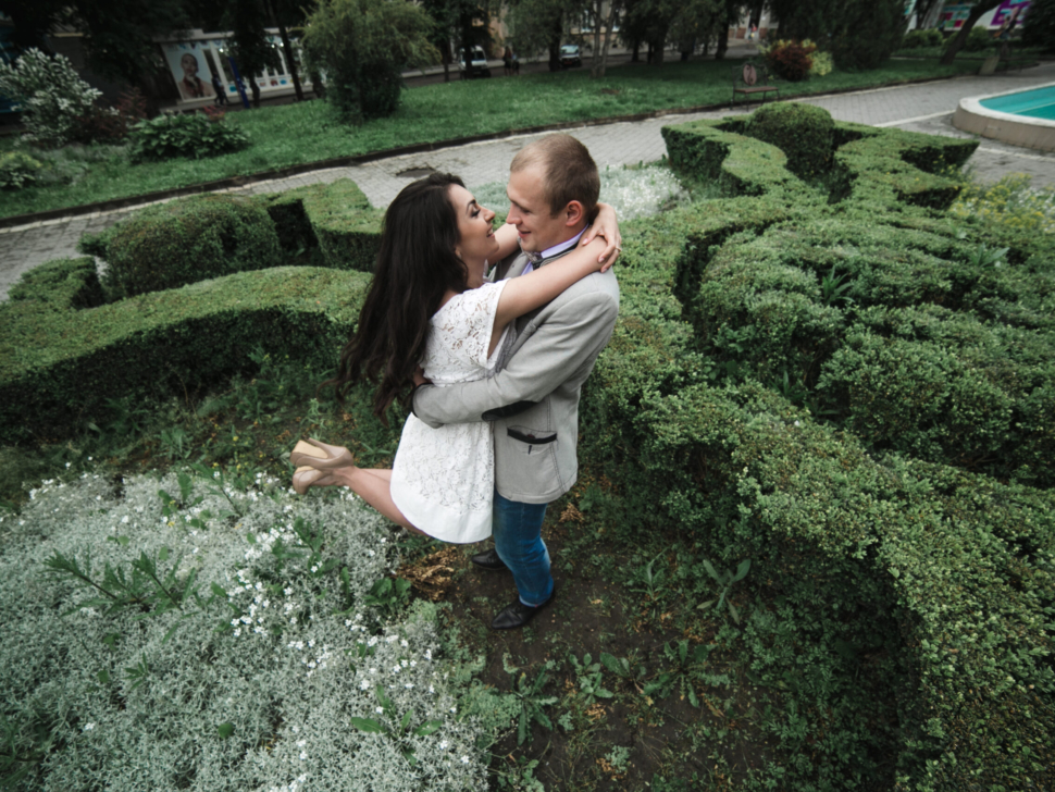 Young and beautiful European couple having a great time on the background of the city